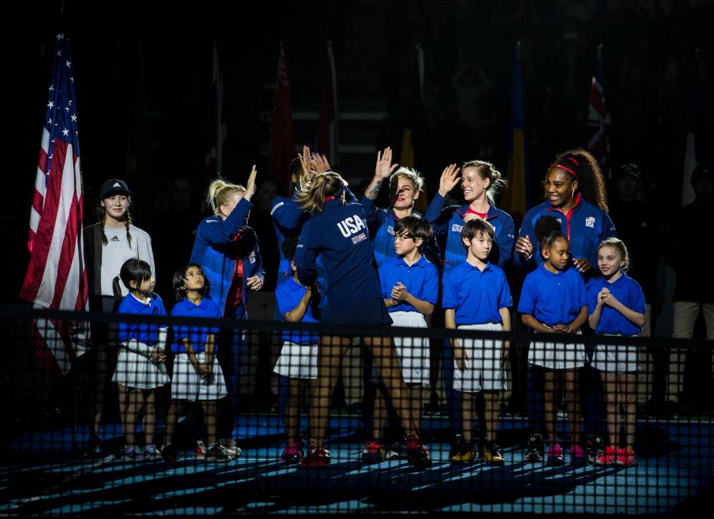 Team USA high fives during the opening ceremony of the Fed Cup at Angel of the Winds Arena on Friday in Everett. (Olivia Vanni / The Herald)