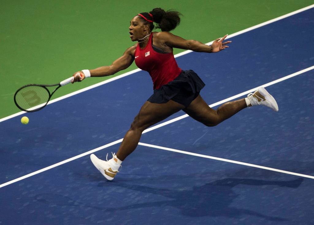 Serena Williams lunges for a ball during her match against Jelena Ostapenko at the Fed Cup at Angel of the Winds Arena on Friday in Everett. (Olivia Vanni / The Herald)
