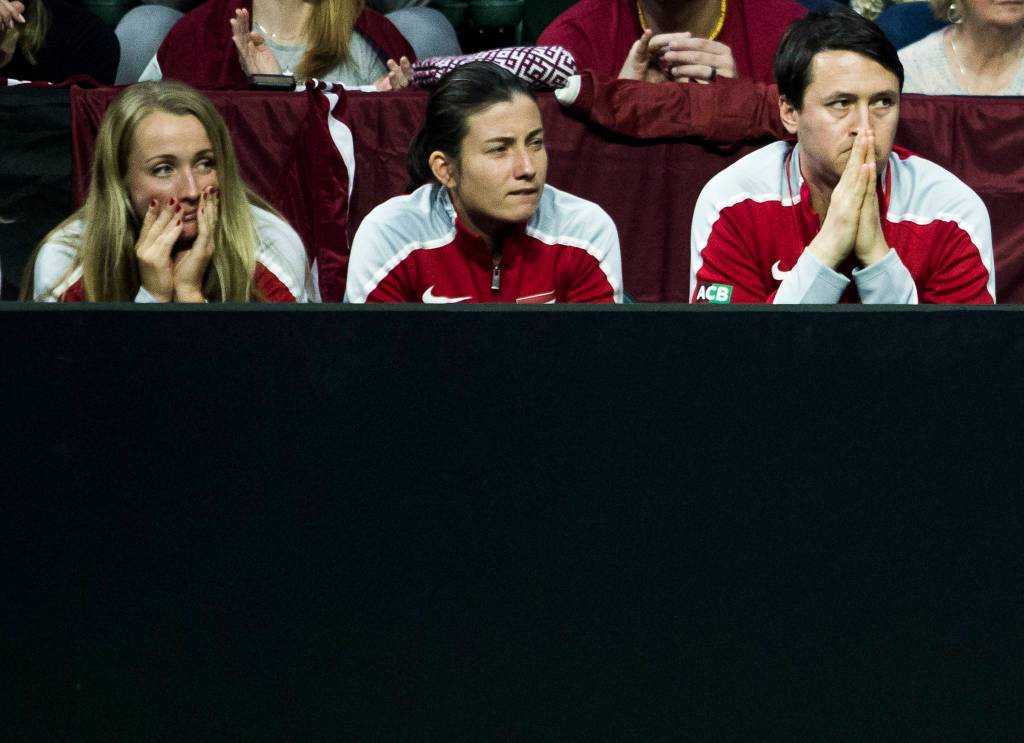 The Latvia bench watches a serve during the Fed Cup at Angel of the Winds Arena on Friday in Everett. (Olivia Vanni / The Herald)