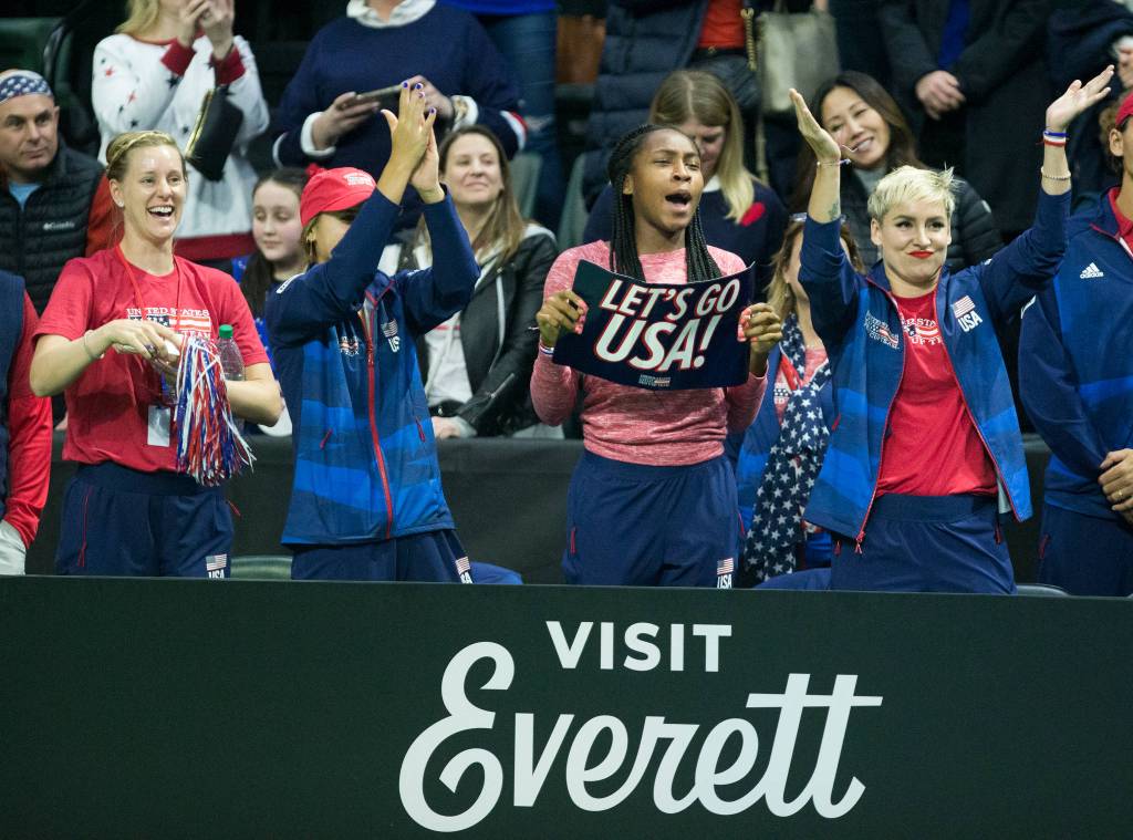 Her teammates celebrate after Serena Williams beats Jelena Ostapenko 7-6, 7-6 during her FedCup qualifying round at Angel of the Winds Arena on Friday in Everett. (Andy Bronson / The Herald)