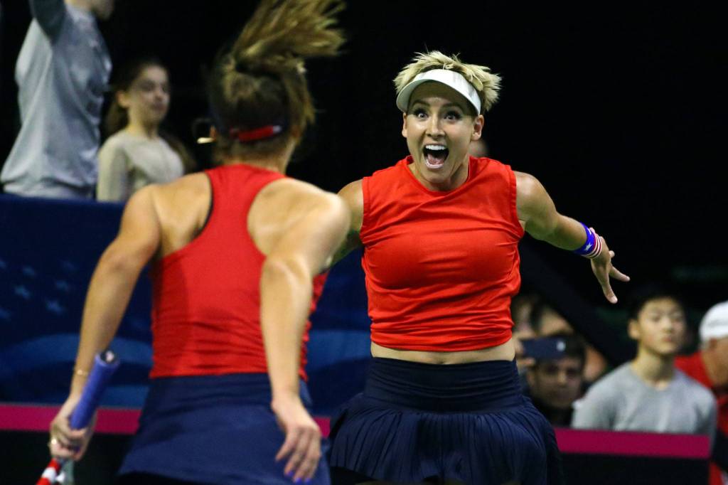 Sofia Kenin (left) and Bethanie Mattek-Sands celebrate their double win to advance in FedCup 2020 Saturday evening at Angel of the Winds Arena in Everett on February 8, 2020. (Kevin Clark / The Herald)