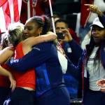 Team USA celebrates the double win to advance in FedCup 2020 Saturday evening at Angel of the Winds Arena in Everett on February 8, 2020. (Kevin Clark / The Herald)