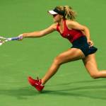 Sofia Kenin plays a return against Latvias Jelena Ostapenko during a Fed Cup qualifier Saturday evening at Angel of the Winds Arena in Everett. (Kevin Clark / The Herald)