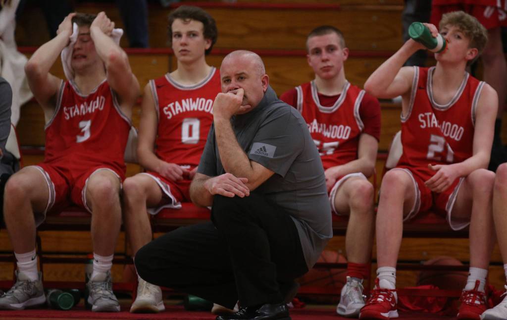 Stanwood coach Zach Ward watches as Marysville Pilchuck beat Stanwood 76-31 in a basketball game Monday, Feb. 10, 2020 in Marysville. (Andy Bronson / The Herald)