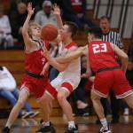 Stanwoods Zane Strieby fouls Marysville Pilchucks Luke Dobler as Marysville Pilchuck beat Stanwood 76-31 in a basketball game Monday, Feb. 10, 2020 in Marysville. (Andy Bronson / The Herald)