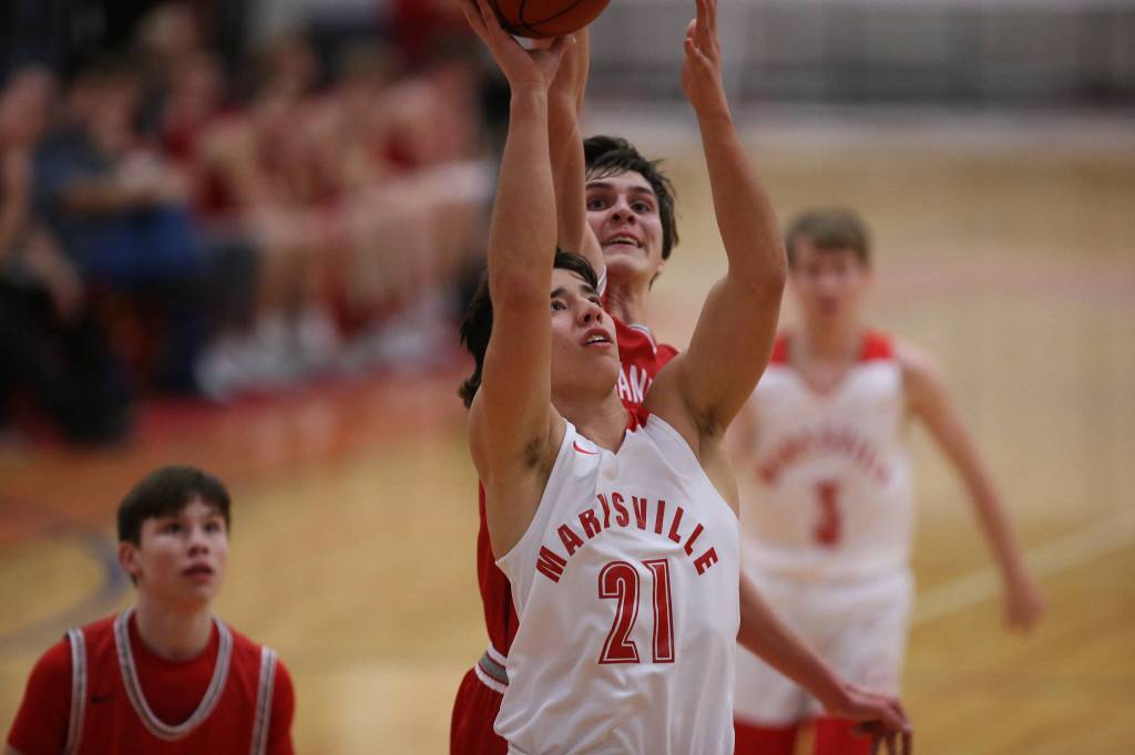 Stanwoods Connor Schlepp blocks a shot by Marysville-Pilchucks Dillion Kuk as Marysville Pilchuck beat Stanwood 76-31 in a basketball game on Monday, Feb. 10, 2020 in Marysville. (Andy Bronson / The Herald)