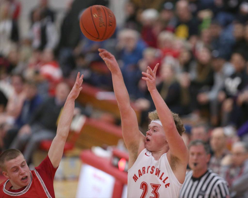 Marysville Pilchucks Cameron Stordahl fires up a 3-point shot as Marysville Pilchuck beat Stanwood 76-31 in a basketball game Monday, Feb. 10, 2020 in Marysville. (Andy Bronson / The Herald)