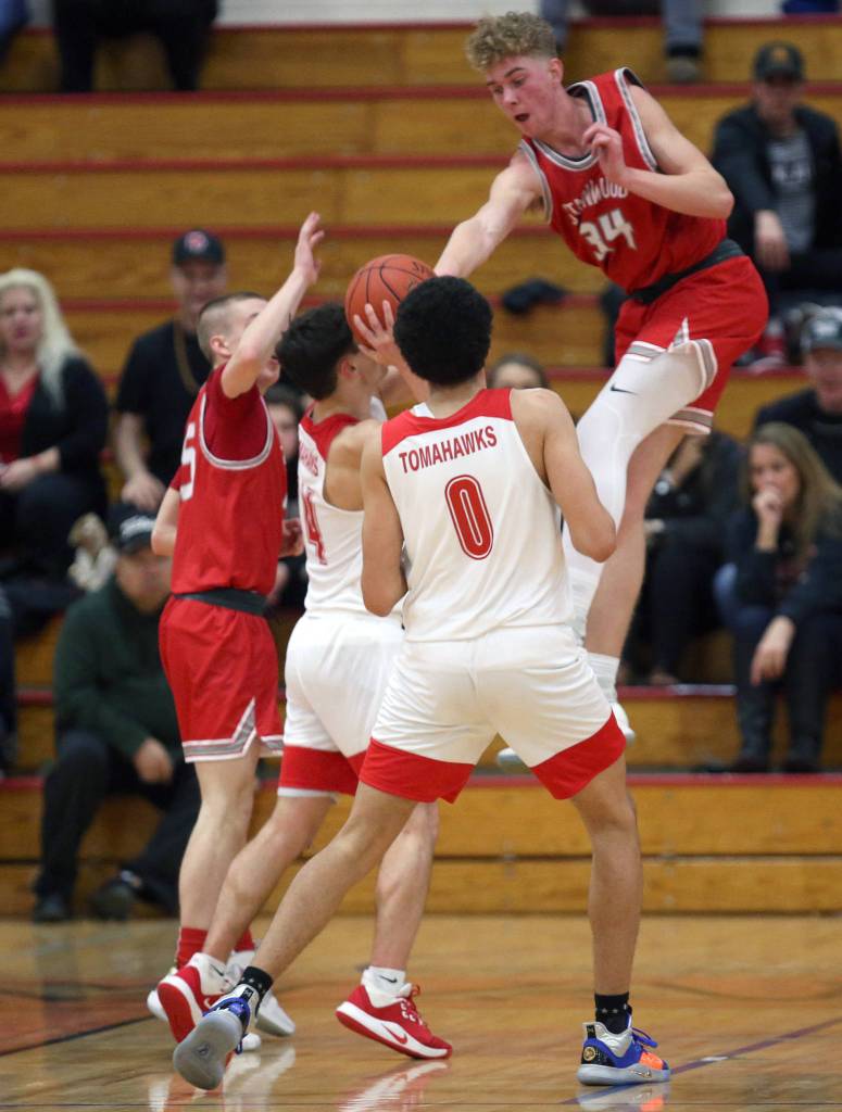 Stanwoods Kaeden McGlothin leaps to attempt a block as Marysville Pilchuck beat Stanwood 76-31 in a basketball game on Monday, Feb. 10, 2020 in Marysville. (Andy Bronson / The Herald)