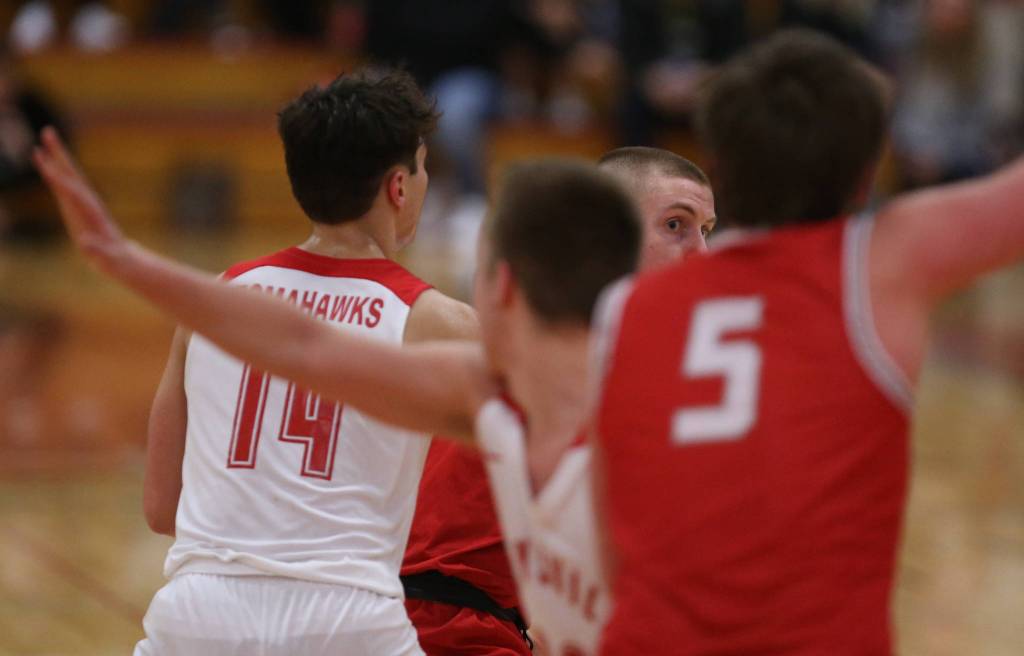 Stanwoods Cort Roberson looks for an open teammate to pass the ball to as Marysville-Pilchuck beat Stanwood 76-31 in a basketball game Monday, Feb. 10, 2020 in Marysville. (Andy Bronson / The Herald)