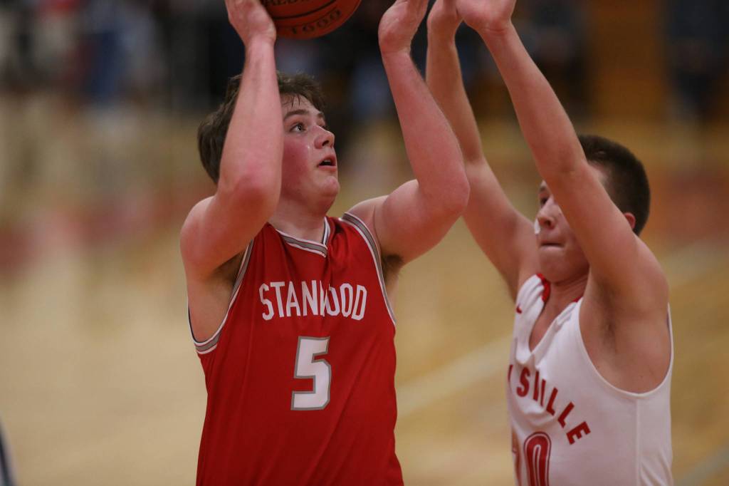 Stanwoods Darren Smith puts up a shot as Marysville Pilchuck beat Stanwood 76-31 in a basketball game Monday, Feb. 10, 2020 in Marysville. (Andy Bronson / The Herald)