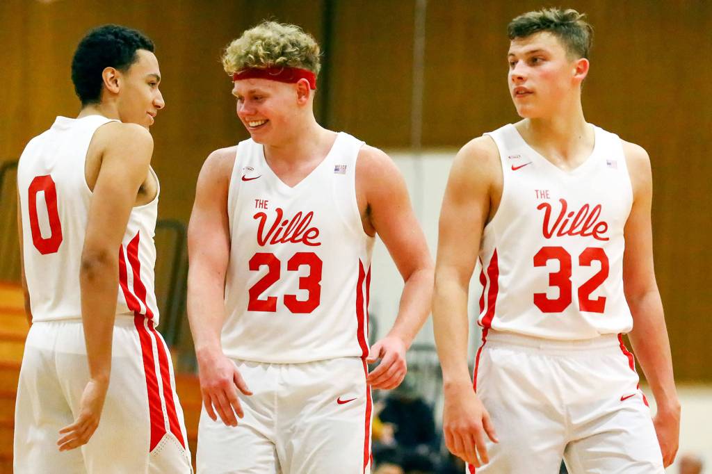 Marysville Pilchucks Ethan Jackson (left-right), Cameron Stordahl and Aaron Kalab on the court against Jackson at Marysville Pilchuck High School on December 11, 2019. The Tomahawks won 67-58. (Kevin Clark / The Herald)