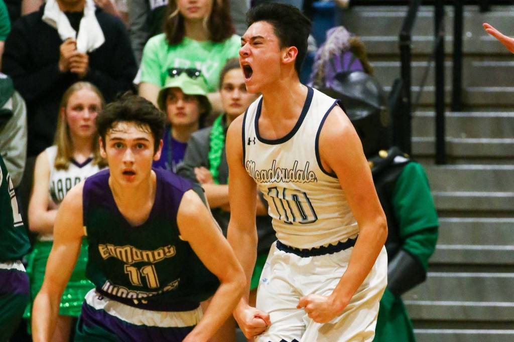 Meadowdales Colton Walsh celebrates during a victory over rival Edmonds-Woodway at Meadowdale High School in Lynnwood on January 24, 2019. (Kevin Clark / The Herald)