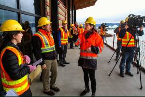 photos by Dan Bates / The Herald                                 WSDOT spokeswoman Diane Rhodes talks with reporters and photojournalists at the passenger terminal under construction at Mukilteo on Thursday.