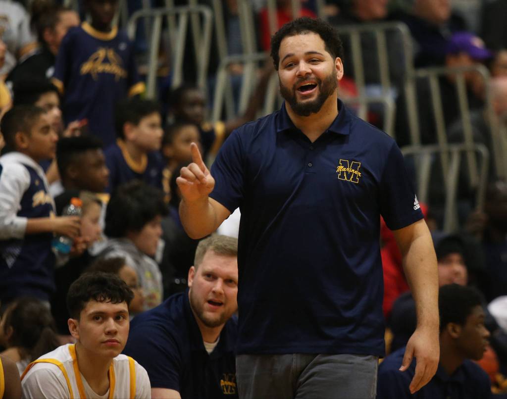 Mariner head coach Tevin Dillon jokes with the referee in the second half as Mariner lost to Glacier Peak 90-87 in double overtime in a boys basketball game on Tuesday, Feb. 11, 2020 in Everett, Wash. (Andy Bronson / The Herald)
