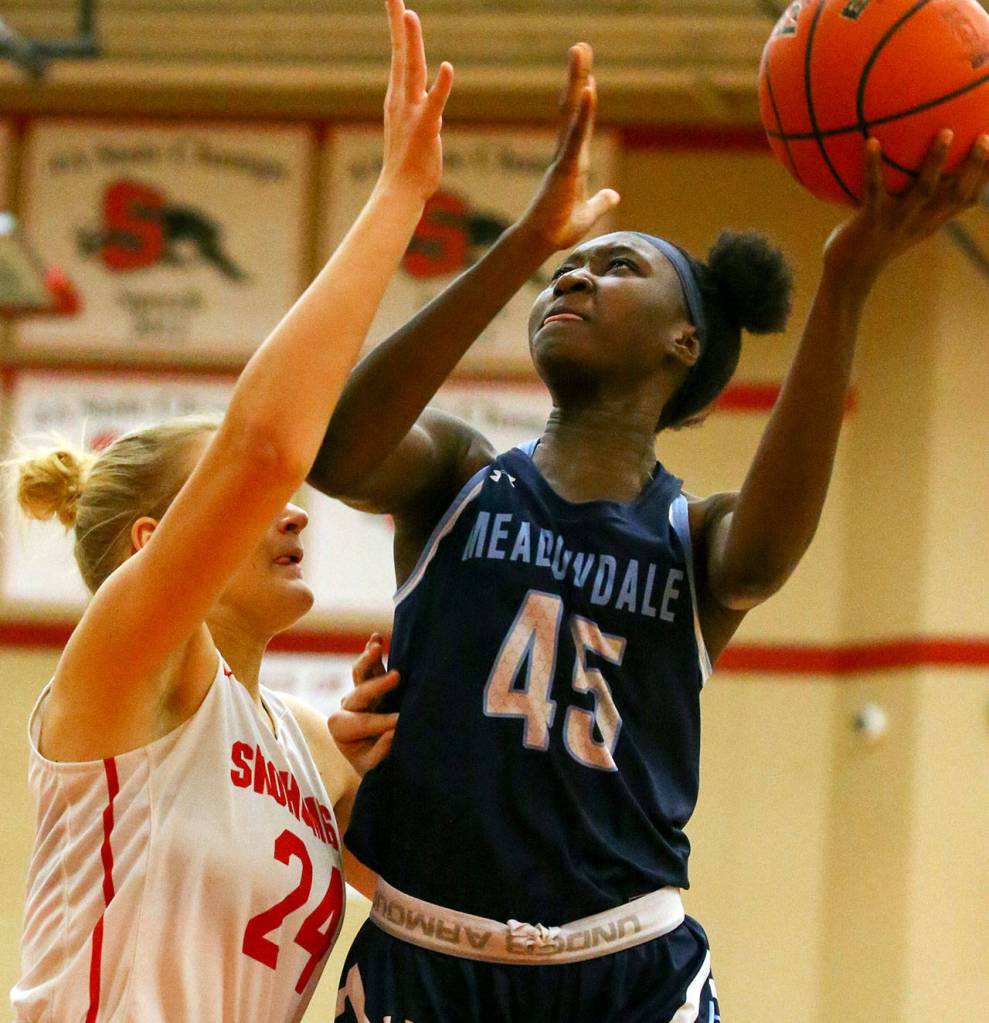 The Snohomish Panthers defeated the Meadowdale Mavericks, 57-39, in a 3A Northwest District Tournament game Friday night at Snohomish High School. (Kevin Clark / The Herald)