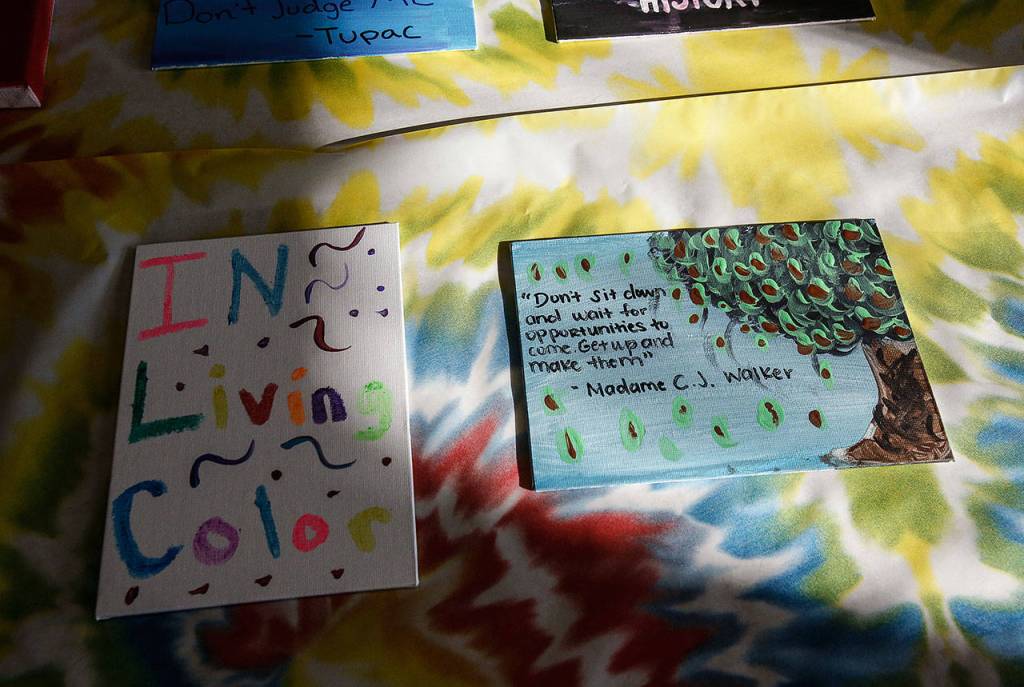 Wednesday at EvCC, students created inspirational artworks carrying the words of noteable African Americans. The small canvases were combined into a mural that was displayed Thursday in Whitehorse Hall on campus. (Dan Bates / The Herald)
