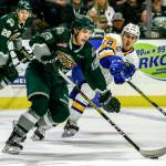 Everetts Brendan Lee controls the puck while being defended by Saskatoons Matej Toman during a Nov. 22, 2019 game at Angel of the Winds Arena in Everett. (Kevin Clark / The Herald)