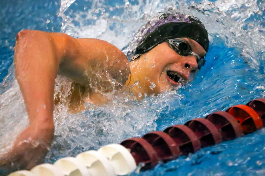 Kamiaks Slava Gilszmer competes in the 200 freestyle at Kamiak High School in Mukilteo on Jan. 30, 2020. (Kevin Clark / The Herald)