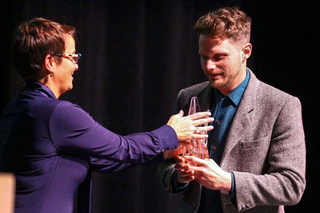 Cassie Franklin presents Richard Porter with his award during The Wendts & Mayors Arts Awards Thursday evening the Everett Performing Arts Center in Everett on Feb. 13. (Kevin Clark / The Herald)