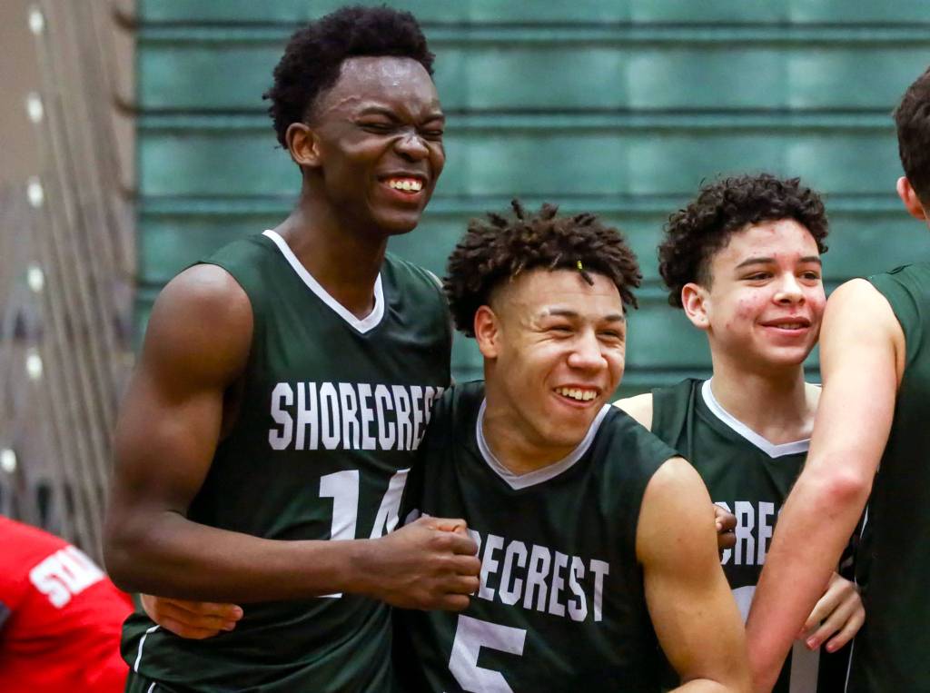 Shorecrest players celebrate their 68-58 victory over Stanwood in a Northwest District Tournament semifinal Wednesday evening at Jackson High School in Mill Creek. (Kevin Clark / The Herald)