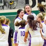 Lake Stevens players celebrate after beating Inglemoor 57-45 in a Wes-King Bi-District Tournament winner-to-state, loser-out game on Thursday at Jackson High School in Mill Creek. (Katie Webber / The Herald)