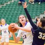 Lake Stevens Camille Jentzsch (left) looks up to shoot a basket against Inglemoor in a Wes-King Bi-District Tournament winner-to-state, loser-out game on Thursday at Jackson High School in Mill Creek. (Katie Webber / The Herald)