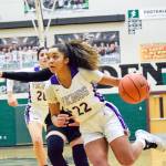 Lake Stevens Raigan Reed dribbles towards the basket against Inglemoor in a Wes-King Bi-District Tournament winner-to-state, loser-out game on Thursday at Jackson High School in Mill Creek. (Katie Webber / The Herald)