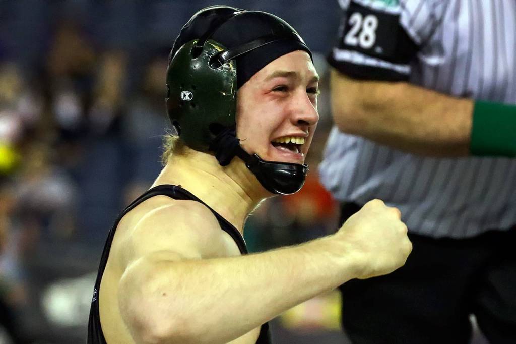 Monroe&rsquo;s Joesph Littrell celebrates his win over Brenden Kennedy of Emerald Ridge after a 4A 160-pound match on Day 1 of Mat Classic XXXII Friday at the Tacoma Dome. (Kevin Clark / The Herald)
