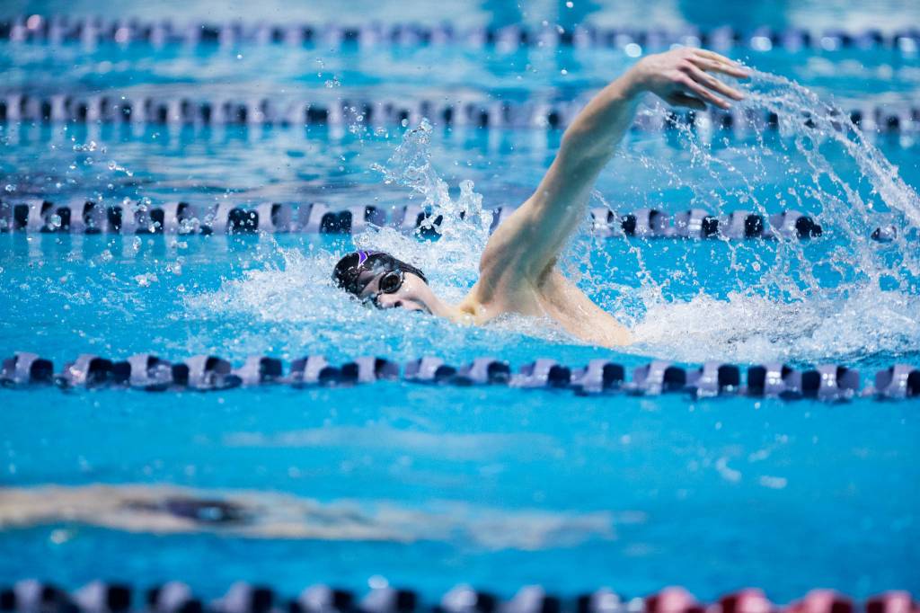 Kamiaks Slava Gilszmer (top) races his his brother, Vlad Gilszmer (bottom), during the 500 freestyle at the 4A state swim and dive championships on Saturday at the Federal Way Aquatic Center. Vlad took first and Slava finished in second place in the event. (Andy Bronson / The Herald)