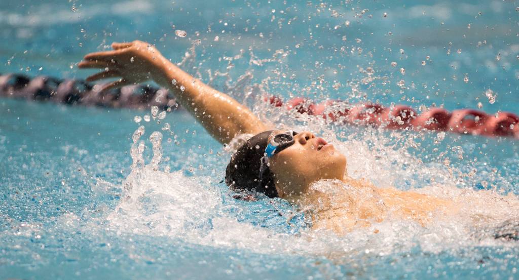 Cascades Henry Nguyen finised in third place in the adaptive 50 backstroke at the 4A state swim and dive championships on Saturday at the Federal Way Aquatic Center. (Andy Bronson / The Herald)