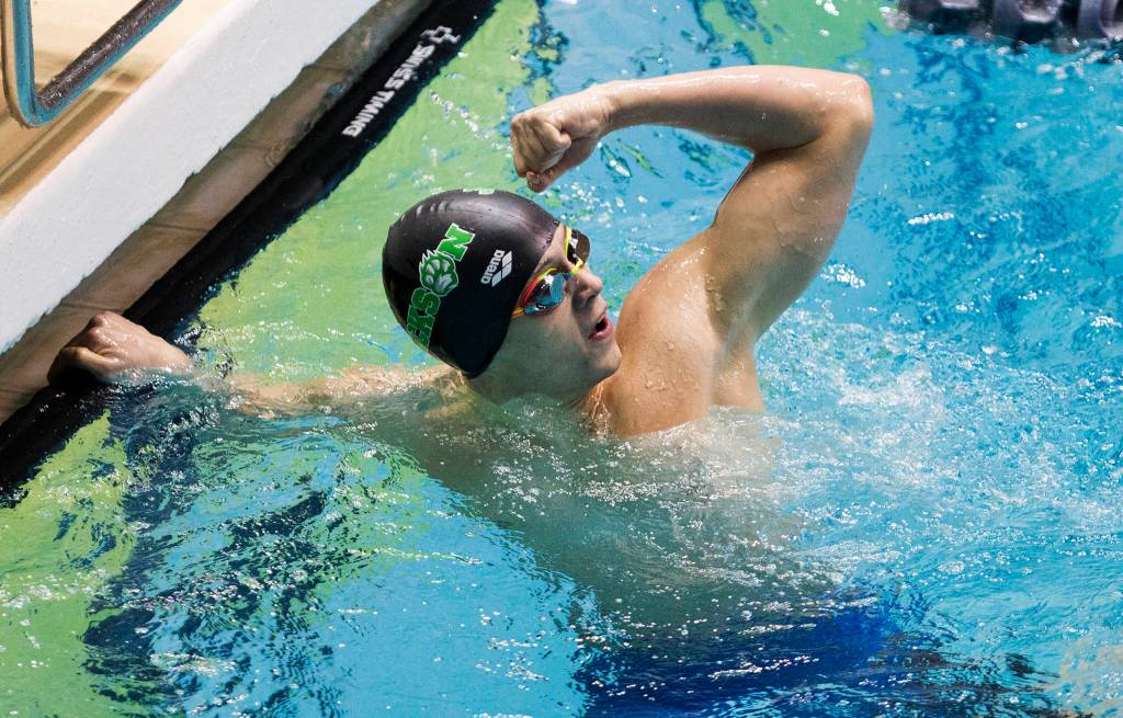 Jacksons Justin Limberg pumps a fist after winning the 4A state title in the 200-yard individual medley Saturday at the Federal Way Aquatic Center. (Andy Bronson / The Herald)