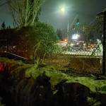 A woman in her 30s allegedly crashed her Nissan Murano off the road, through a fence, and into an Everett Fire Department station on Madison Street on Saturday night. (Everett Fire Department)