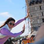 Megan Dority poses for a photo with the so called Leaning Tower of Dallas as a crew worked unsucessfully to topple the structure north of downtown Dallas on Monday. (AP Photo/LM Otero)