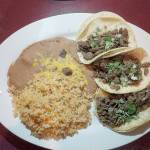 Street tacos are tender chopped beef wrapped in corn tortillas and garnished with cilantro, onion and lime. (Sara Bruestle / The Herald)
