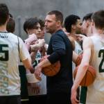 Head coach Corby Schuh cheers with the team during practice on Wednesday, Feb. 26, 2020 in Marysville, Wash. (Olivia Vanni / The Herald)