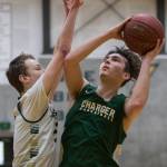 Will Dunn, right, attempts a layup as Ryan Allison, left, blocks during practice on Wednesday, Feb. 26, 2020 in Marysville, Wash. (Olivia Vanni / The Herald)