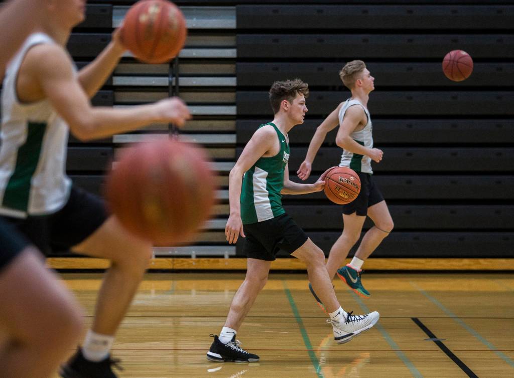 Alex Owens warms up during practice on Wednesday, Feb. 26, 2020 in Marysville, Wash. (Olivia Vanni / The Herald)