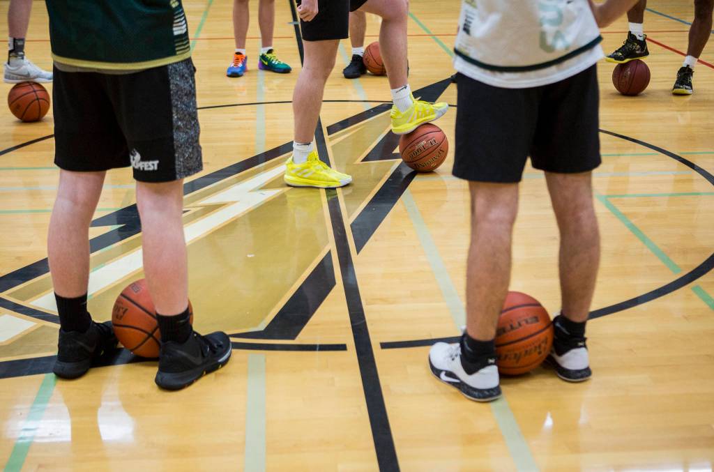 Players prepare for the start of practice on Wednesday, Feb. 26, 2020 in Marysville, Wash. (Olivia Vanni / The Herald)