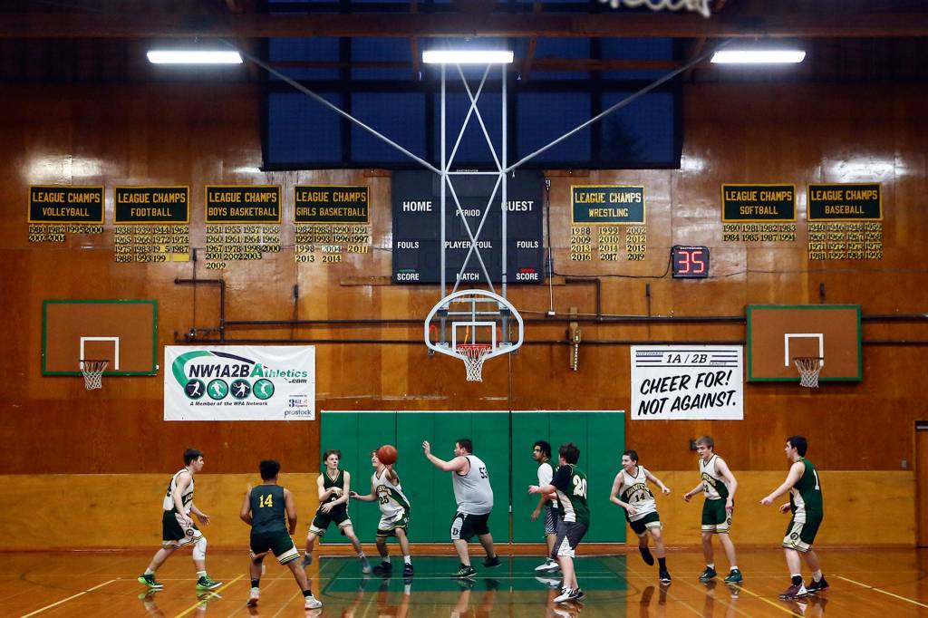 Darrington High&rsquo;s basketball team practices Tuesday evening in Darrington on February 25, 2020. (Kevin Clark / The Herald)
