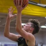 Marysville Getchells Alex Owens elevates for a layup during a 3A state regional game against Mount Tahoma on Friday in Puyallup. (Olivia Vanni / The Herald)