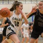 Arlingtons Hannah Rork (12) drives to the hoop during a 3A state regional game against Lake Washington on Saturday in Shoreline. (Olivia Vanni / The Herald)