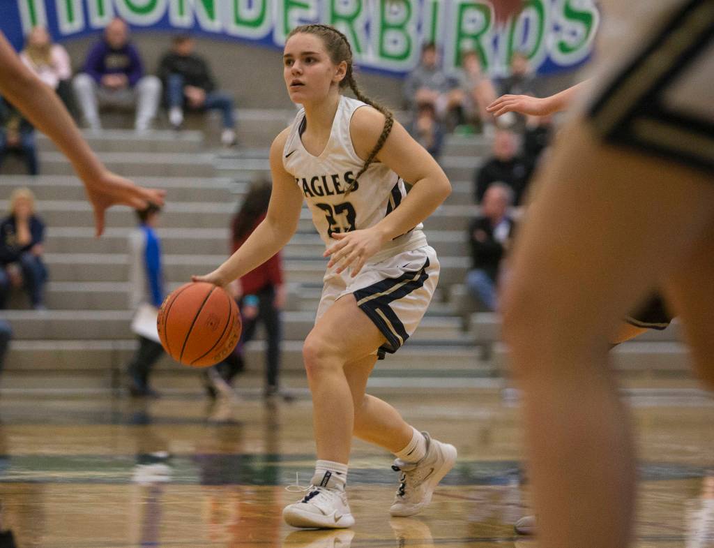 Arlingtons Allison DeBerry looks for an open teammate during a 3A state regional game against Lake Washington on Saturday in Shoreline. (Olivia Vanni / The Herald)
