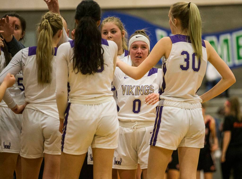 Lake Stevens players begin to cry after losing to Camas on Saturday, Feb. 29, 2020 in Shoreline, Wa. (Olivia Vanni / The Herald)
