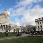 In this Feb. 3 photo, people gather at the sundial in front of the Legislative Building at the Capitol in Olympia. (AP Photo/Ted S. Warren, FILE)