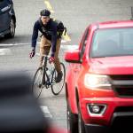 Warland Hewitt Wight rides his bike through traffic March 13, 2018 in Everett. A new state law specifies that drivers must give at least 3 feet when passing vulnerable road users, such as bicyclists, pedestrians and tractors. (Ian Terry / Herald file)