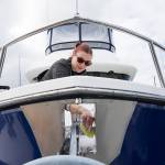 Andy Bronson / The Herald                                 Kelly Jane Heindel cleans and details a 40-foot yacht at the Everett Marina.