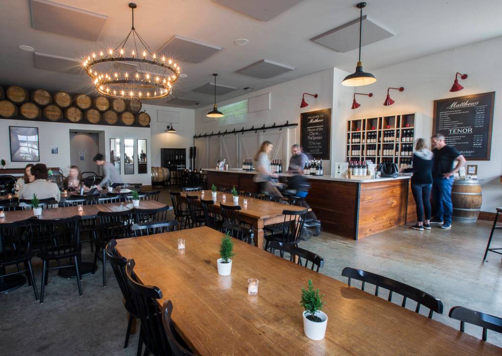 People gather in Matthews Winerys tasting area on Friday in Woodinville. (Olivia Vanni / The Herald)