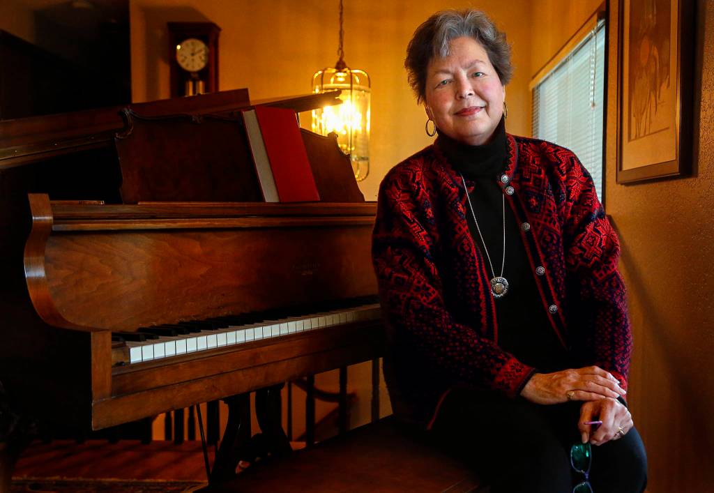 Dan Bates / The Herald                                At home in Edmonds, Catherine Fransson talks about her memoir Loving the Enemy, which centers on her relationship with her late father. A retired high-school teacher and pastor, she is also a classical pianist.