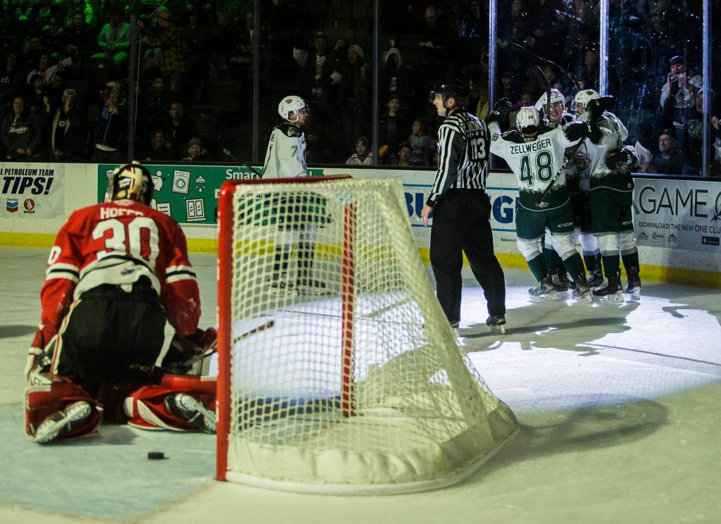 The Silvertips gather around Ty Kolle after his goal during the game against the Portland Winterhawks on Sunday, March 1, 2020 in Everett, Wa. (Olivia Vanni / The Herald)