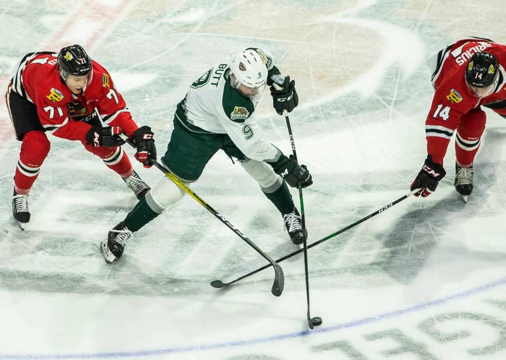 Silvertips Dawson Butt fights for the puck during the game against the Portland Winterhawks on Sunday, March 1, 2020 in Everett, Wa. (Olivia Vanni / The Herald)